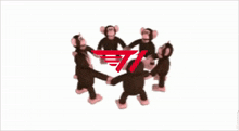 a group of stuffed monkeys are dancing in a circle with a red t1 logo in the background