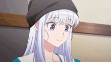 a girl with white hair wearing a black beanie