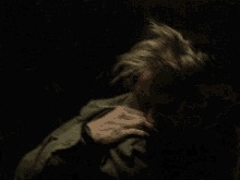 a man with a cigarette in his mouth is laying on the floor