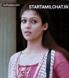 a close up of a woman 's face with the words starttamilchat.in above her .