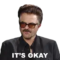 a man with glasses and a mustache says it 's okay