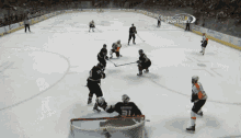 a hockey game is being played on the comcast sportsnet channel