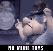 a cartoon character is giving the middle finger in front of a picture of a man in a top hat .