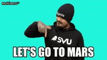 a man wearing a hoodie that says " let 's go to mars " on it