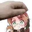 a hand is putting a hat on a little girl .