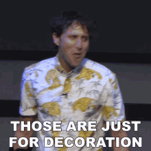 a man wearing a hawaiian shirt says those are just for decoration