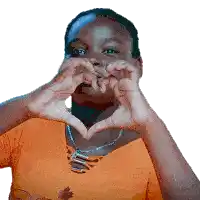 a woman is making a heart with her hands